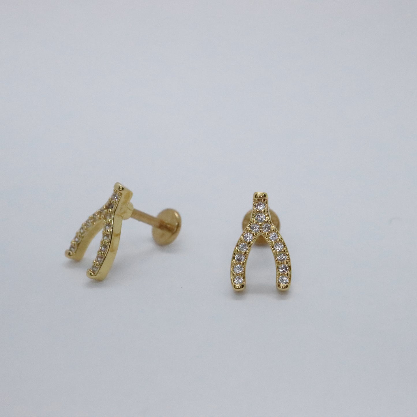 Chic gold lucky charm earrings with a flat back design