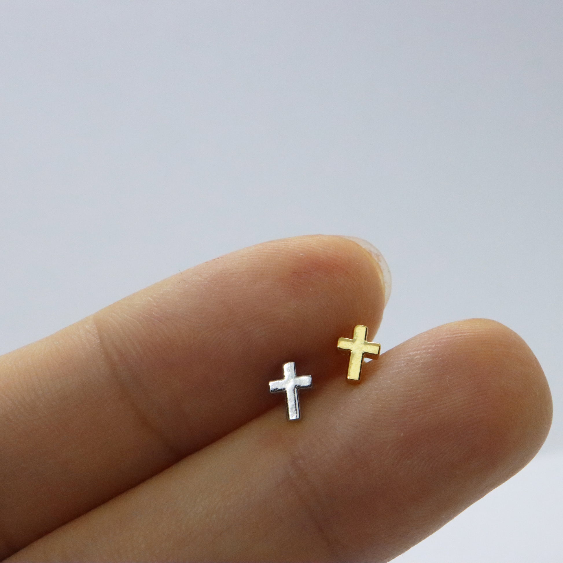 Chic gold and silver cross earrings for versatile styling