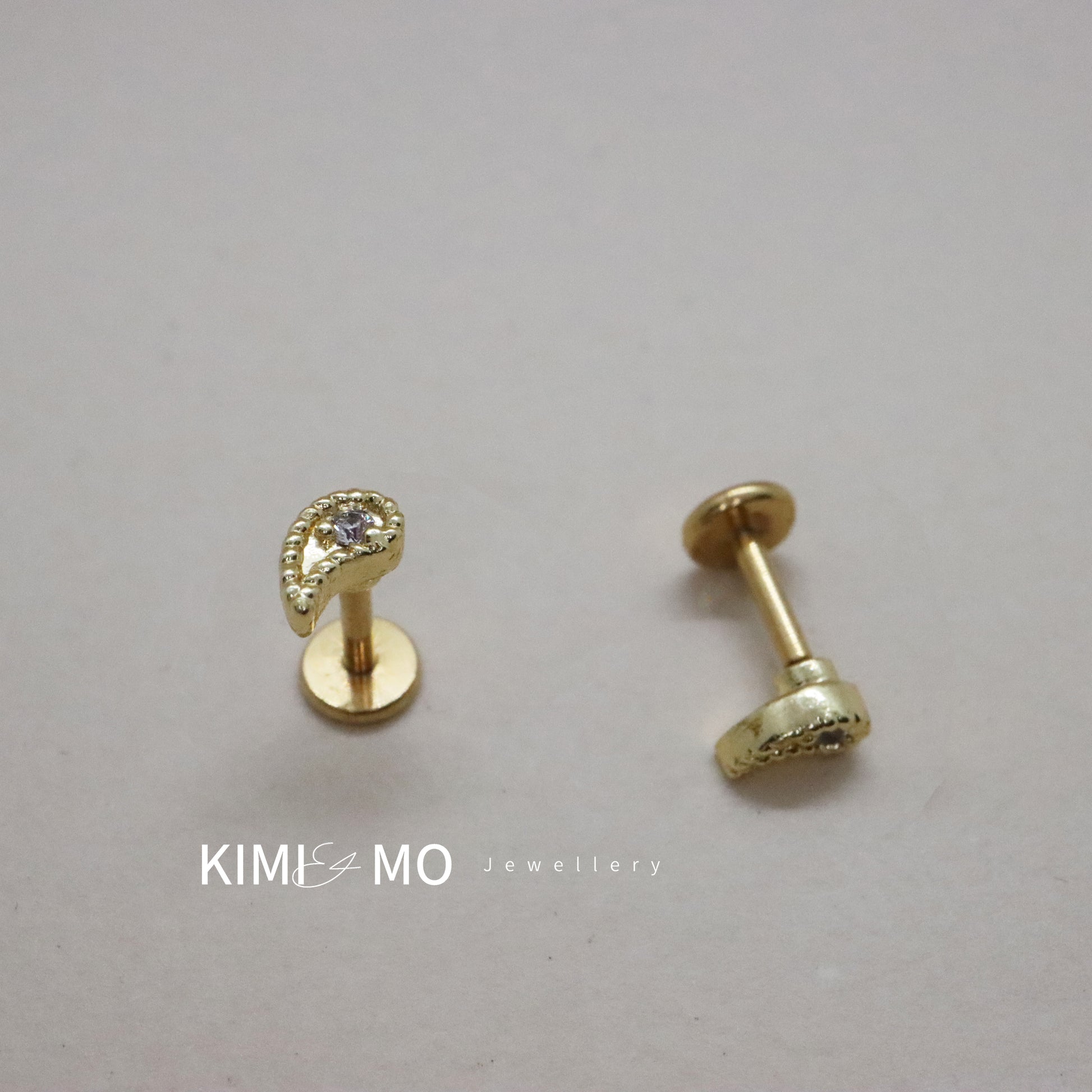 Chic teardrop-shaped gold earrings with threadless back