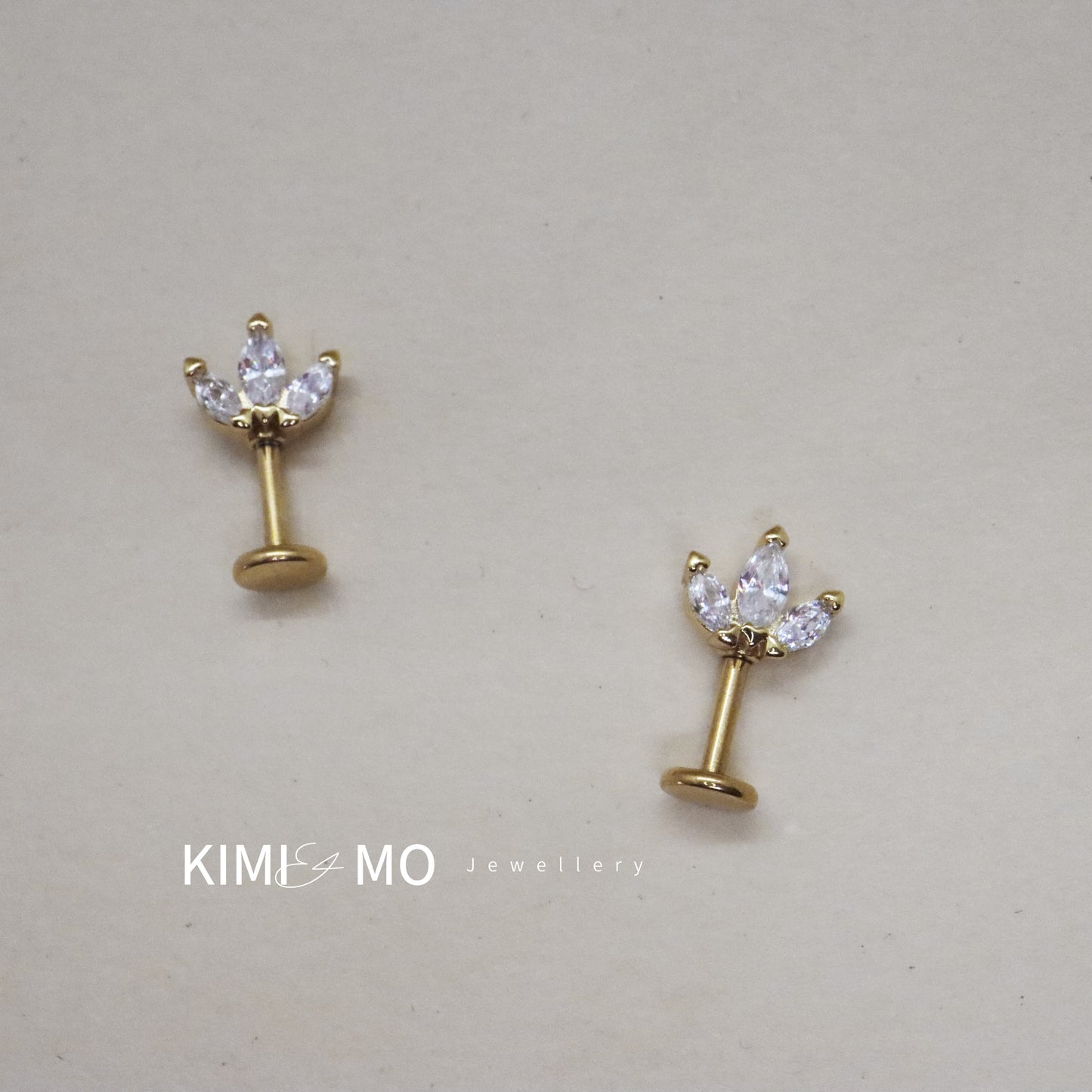 Classic gold and gemstone earrings with a petal design