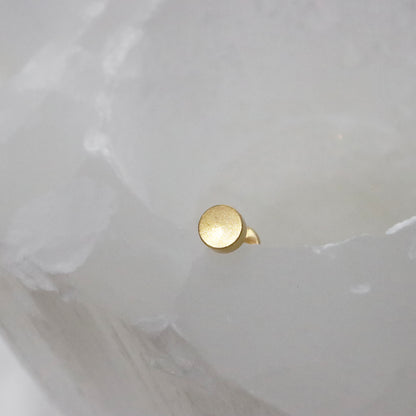 Classic gold stud earrings with a polished flat back