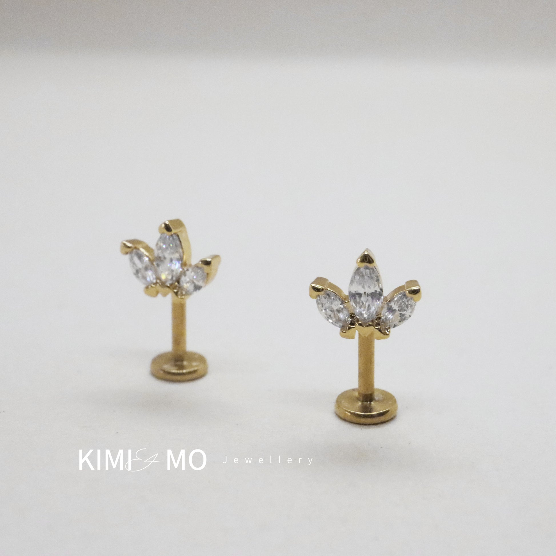 Elegant gold stud earrings with marquise cut gems