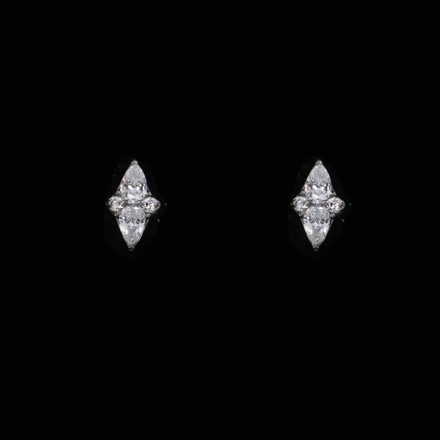 Elegant threadless stud earrings with a diamond centerpiece