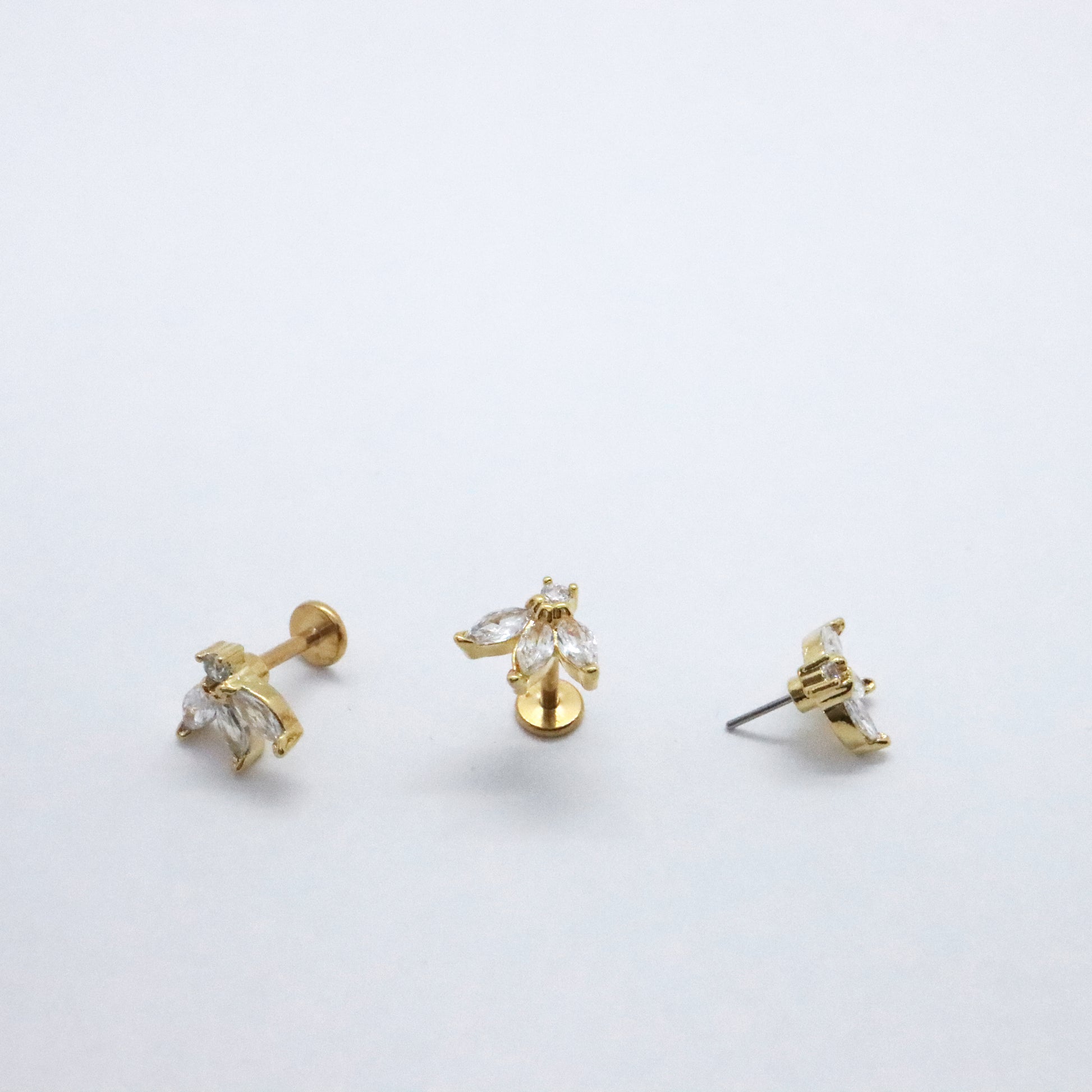 Gold flat back earrings with crystal flower design