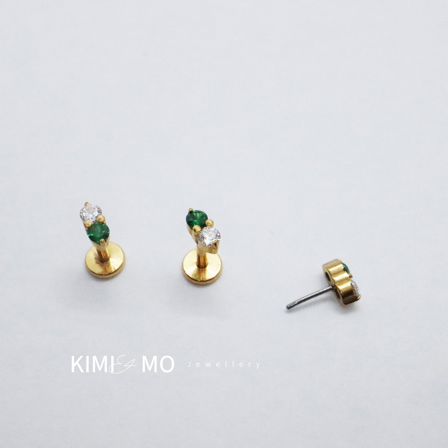 Gold studs with emerald and diamond for a classic look