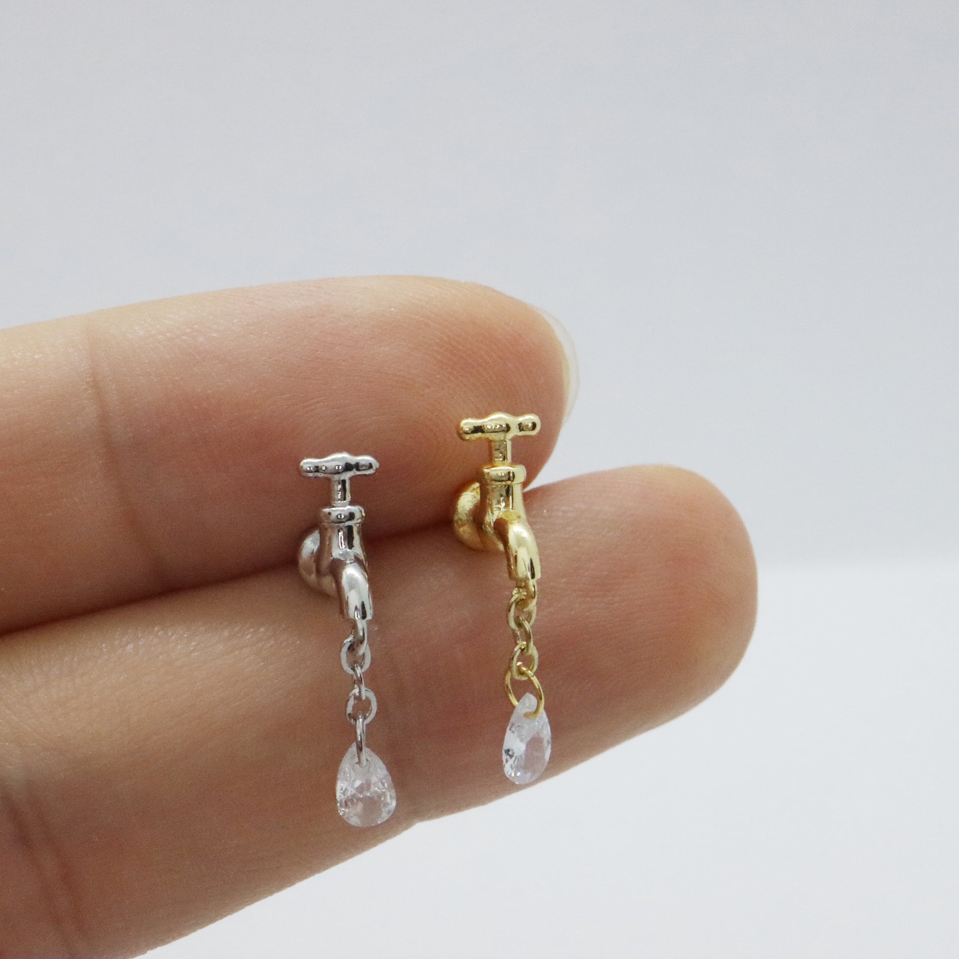 Gold threadless faucet earrings with sparkling gemstone detail