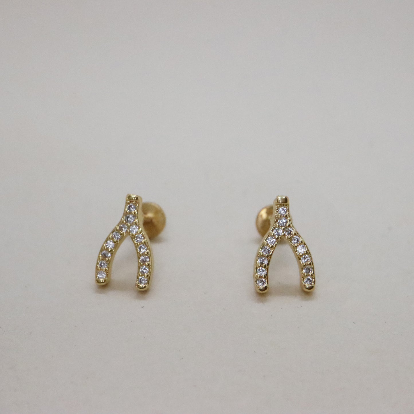 Gold wishbone earrings with pave gemstones and push pin back