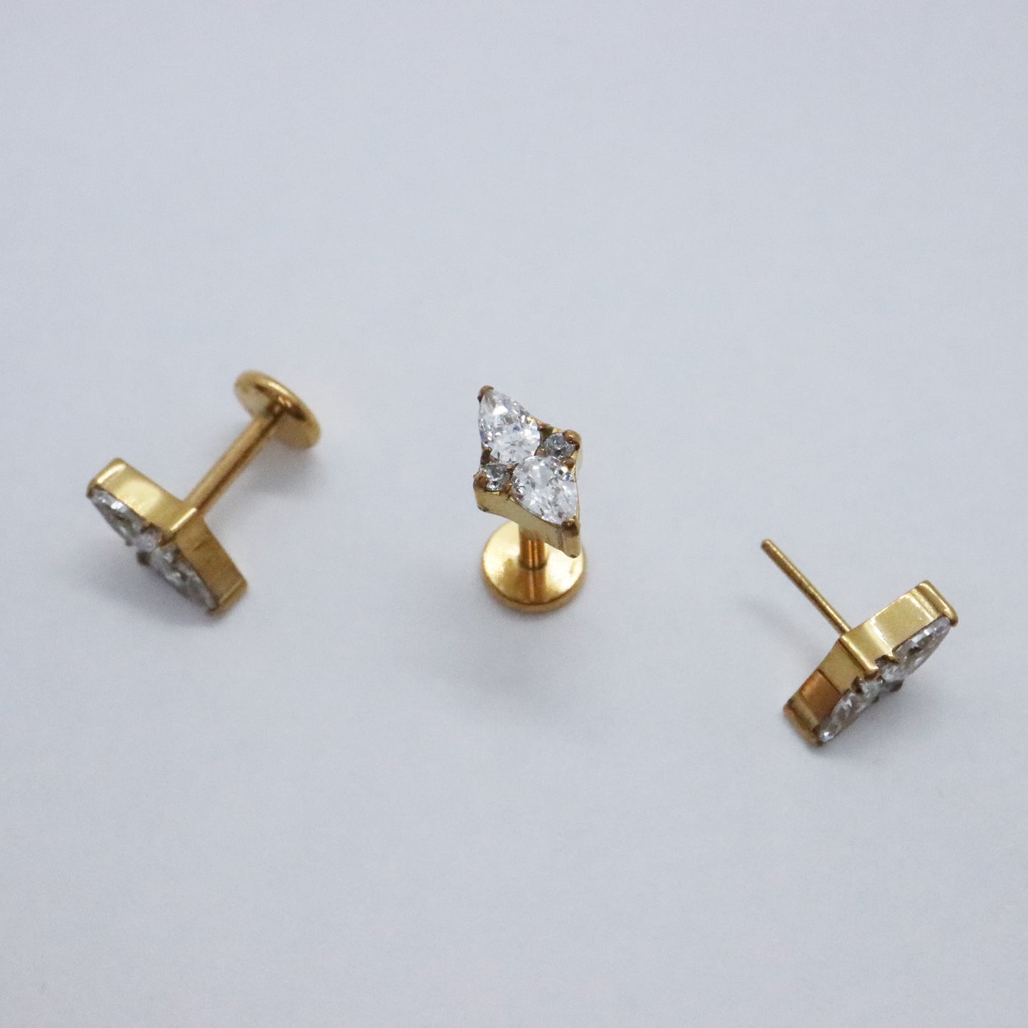 Hypoallergenic marquise diamond earrings in gold setting