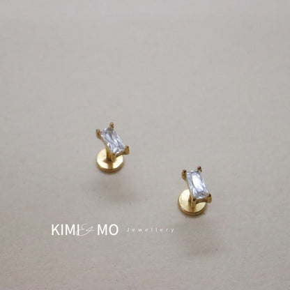 Minimalist gold bar stud earrings with sparkling gemstone