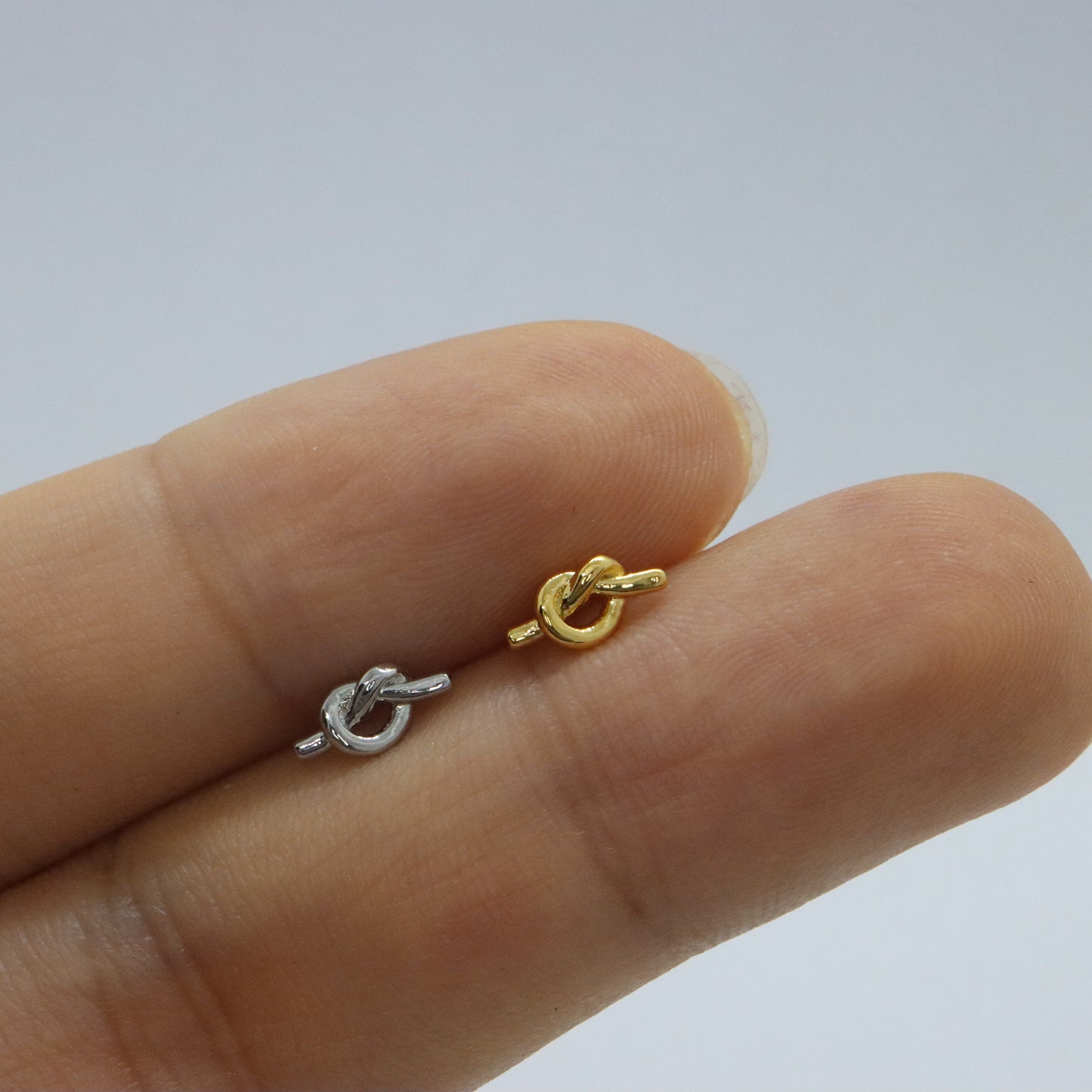 Minimalist gold knotted earrings with timeless appeal