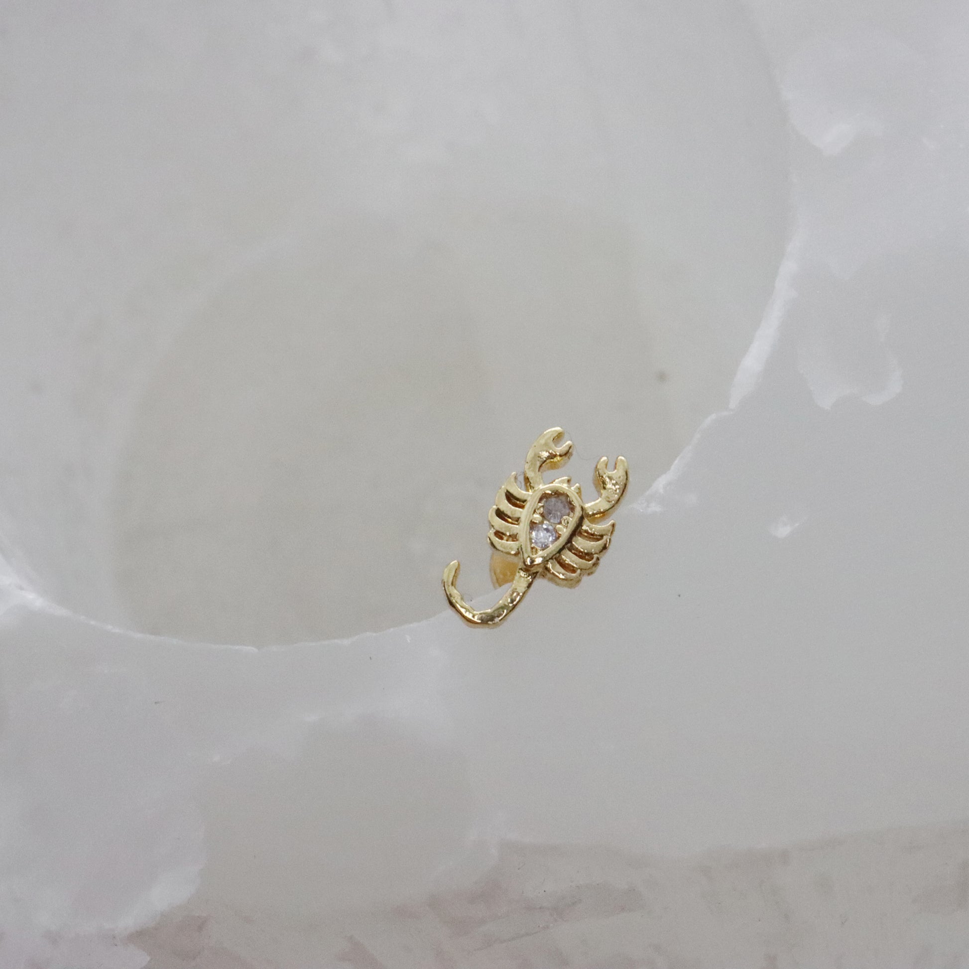 Nature-inspired scorpion earrings in gold with gemstone detail