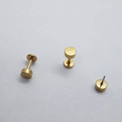 Simple gold disc stud earrings with a matte finish