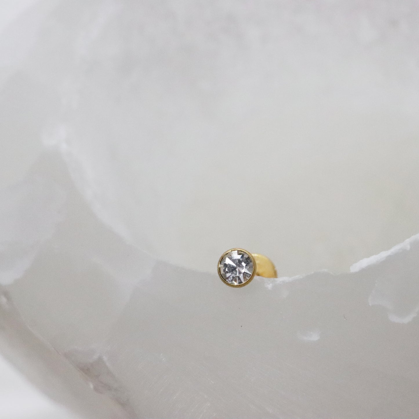 Timeless round gemstone studs on a gold base