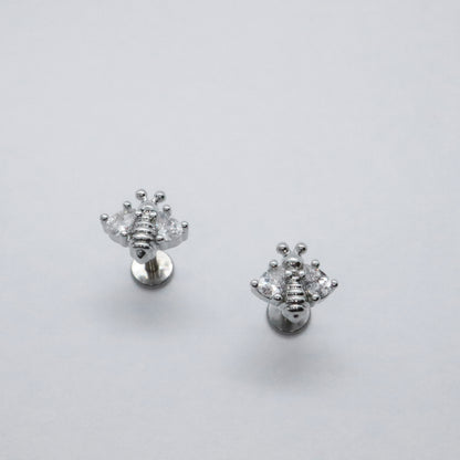 Trendy silver bee stud earrings with a modern flat back design