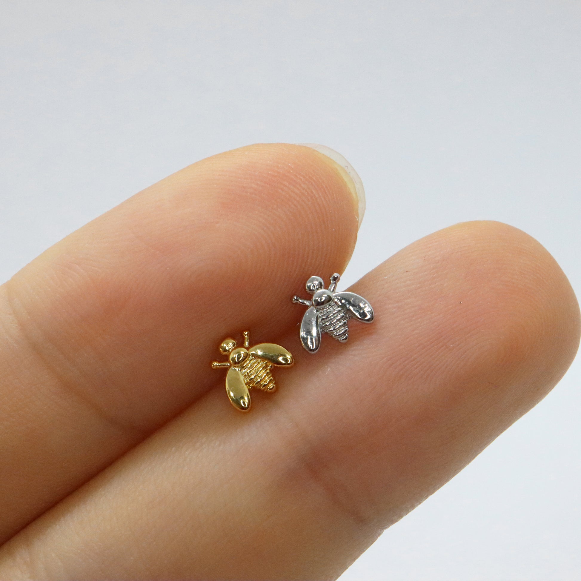 Versatile gold and silver bee stud earrings for any occasion